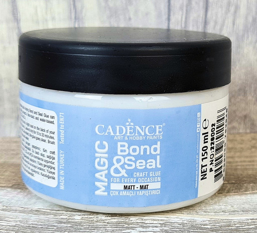 Cadence Magic Bond & Seal Matt – 150ml
Cadence Magic Bond & Seal Matt is a versatile 2-in-1 water-based adhesive and sealer, designed for decoupage, mixed media, home décor, and upcycling projects. Its matt finish provides a smooth, non-reflective look, making it ideal for vintage, shabby chic, and natural-style creations.
The clear-drying formula bonds paper securely while sealing and protecting your finished work. Suitable for a variety of surfaces including wood, MDF, canvas, glass, ceramic, fabric, pl